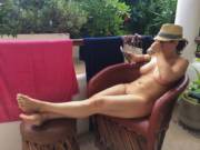 Coffee, Kindle and Relaxing Out Back Nude