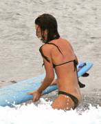 Evangeline Lilly surfing.