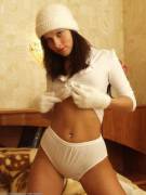 It's so cold that she needs a hat, gloves, and big panties.