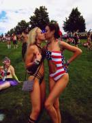 2 girls kissing in swimsuits