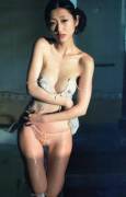 Wet Asian body; bathing with her clothes on