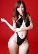 Curvy Asian beauty in a black bathing Suit