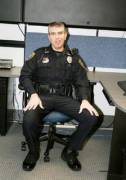 Hot cop sitting with his legs spread (would love to get between them)