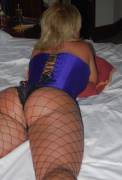 Blonde in corset and fishnets