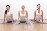 3 clothed ladies doing yoga