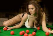 Snooker is played using a cue and 22 snooker balls: one white cue ball, 15 red balls worth one point each, and six balls of different colours: yellow (2 points), green (3), brown (4), blue (5), pink (6) and black (7). [Wikipedia]