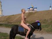 Olga T riding a pony in Ryazan, Kremlin