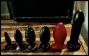My size progression of plug sizes over the past 3 months. By 'stretch' of the imagination, any suggestions for what to get next? Last item is Tantus A Bomb.