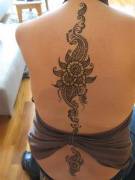 Henna - Flowers along the spine.