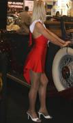 Red dress at a car show