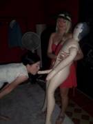 Sisters playing with a blowup doll