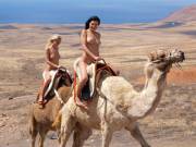 JUDITA A &amp; friend riding camels.