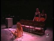 Performance involving stripping naked on top of vibrating washing machine to choir music