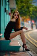 Long, Leggy Redhead Chillin' on Front Steps