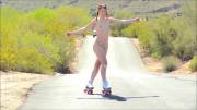 Aurora Belle roller skating on the road (gif)