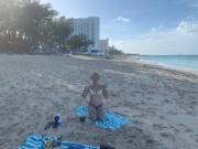 The peeling off of clothes, moved to the beach