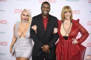 Nina Kayy and Sara Jay with Rome Major at the AVN Awards 2018