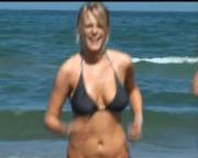 Flashing her boobs on the beach [gif] via /r/FlashingGirls