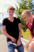 Guy shows his bro his big uncut cock on the side of the road [GIF]