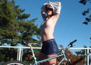 Redhead washing her bike (and herself)